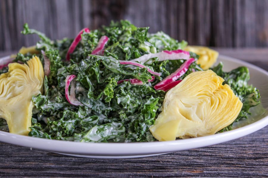 Kale Caesar Salad with Pickled Red Onions and Artichoke Hearts