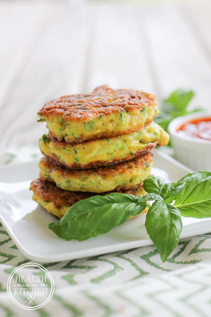 This Zucchini Fritters Recipe is so easy to make and addictively delicious!  They are crispy on the outside and soft on the inside. This recipe is vegetarian and includes paleo & gluten-free alternatives as well. You'll want to make several batches for the freezer to enjoy all winter long!