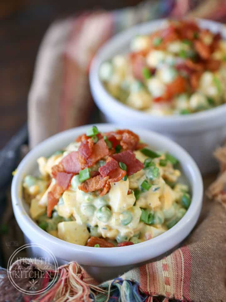 This delicious and Easy to make English Pea Salad Recipe is loaded with hard boiled eggs, bacon, celery, red onion, red pepper and cheddar cheese all blended together with a creamy mayonnaise dressing. 