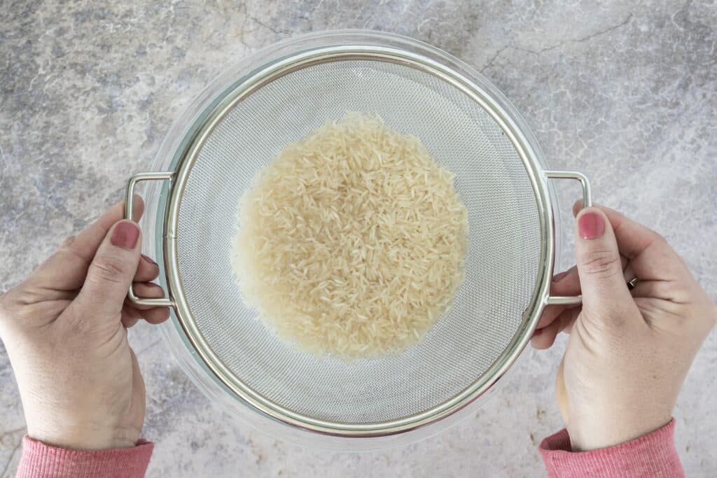 basmati rice in a strainer