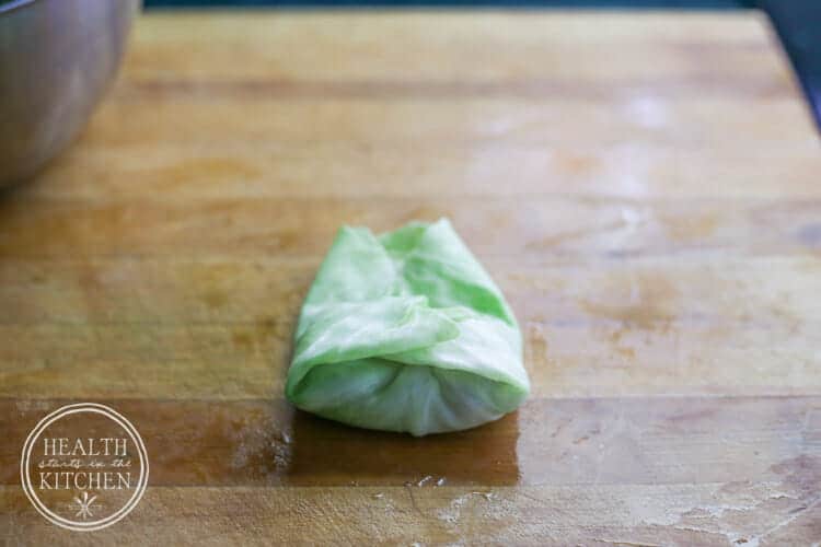 Left side of the cabbage leaf folded over the filling