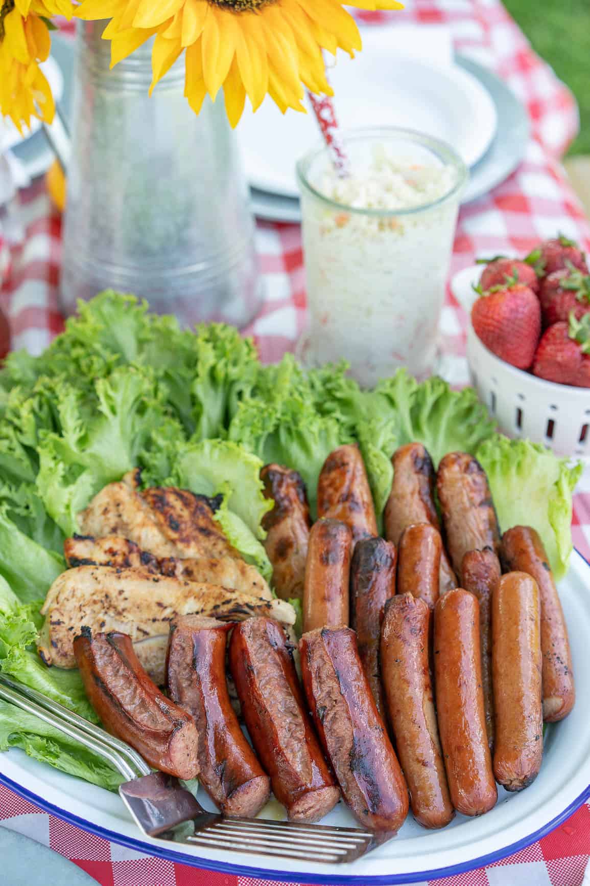 Grilled meats on a platter with lettuce 