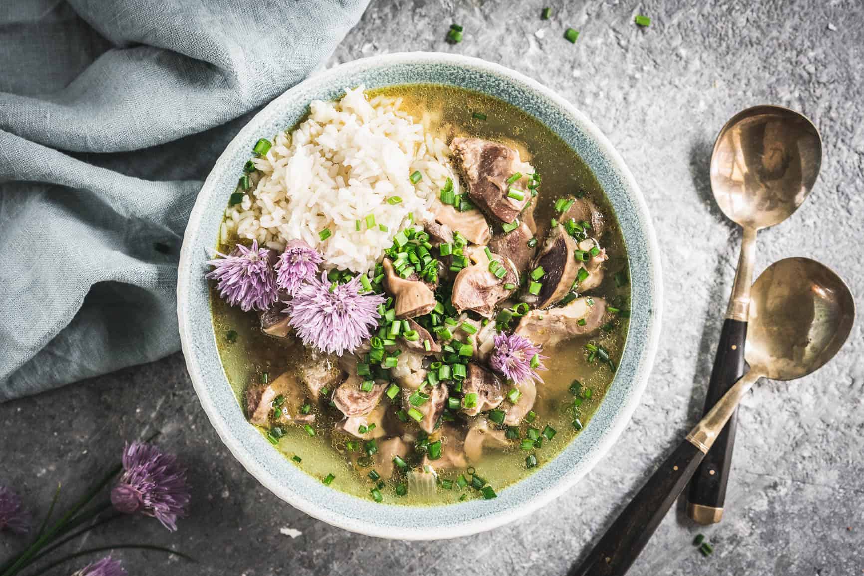Pressure Cooker Chicken Gizzards and Broth served with Rice and Chive Blossoms y