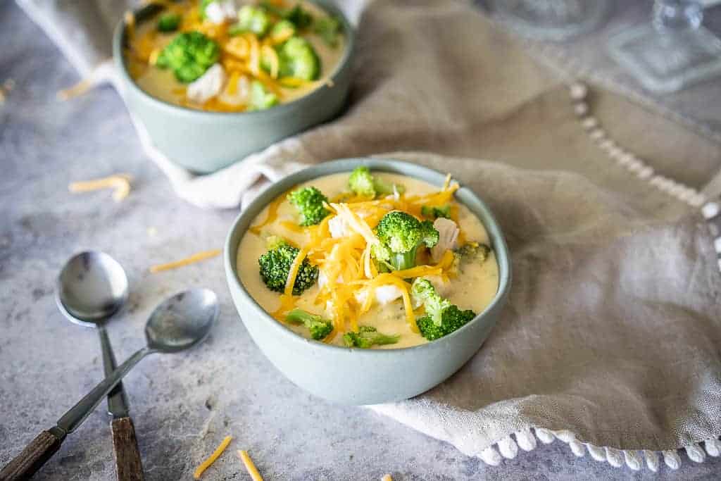From start to finish, you need less than 30 minutes to whip up a batch of my Easy Keto Broccoli Cheese Soup with Chicken.  Thick, creamy and delicious, you'll never guess that this low carb soup has only 9g net carbs per serving!