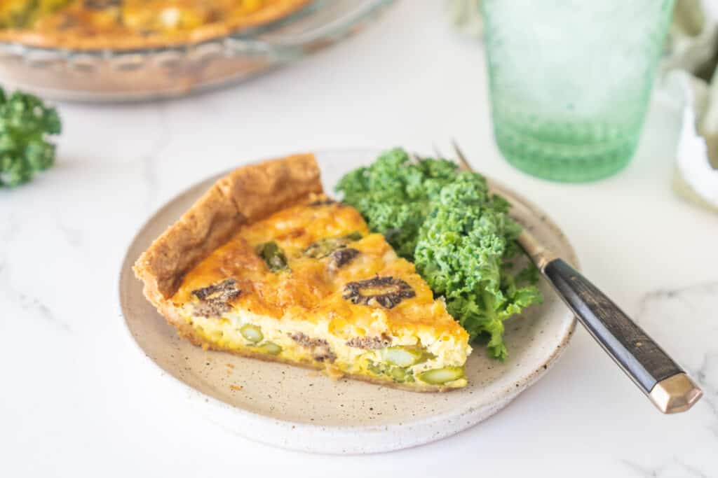 Morel Mushroom and Asparagus Quiche with kale garnish