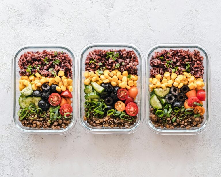 Colorful meal prep containers with grains