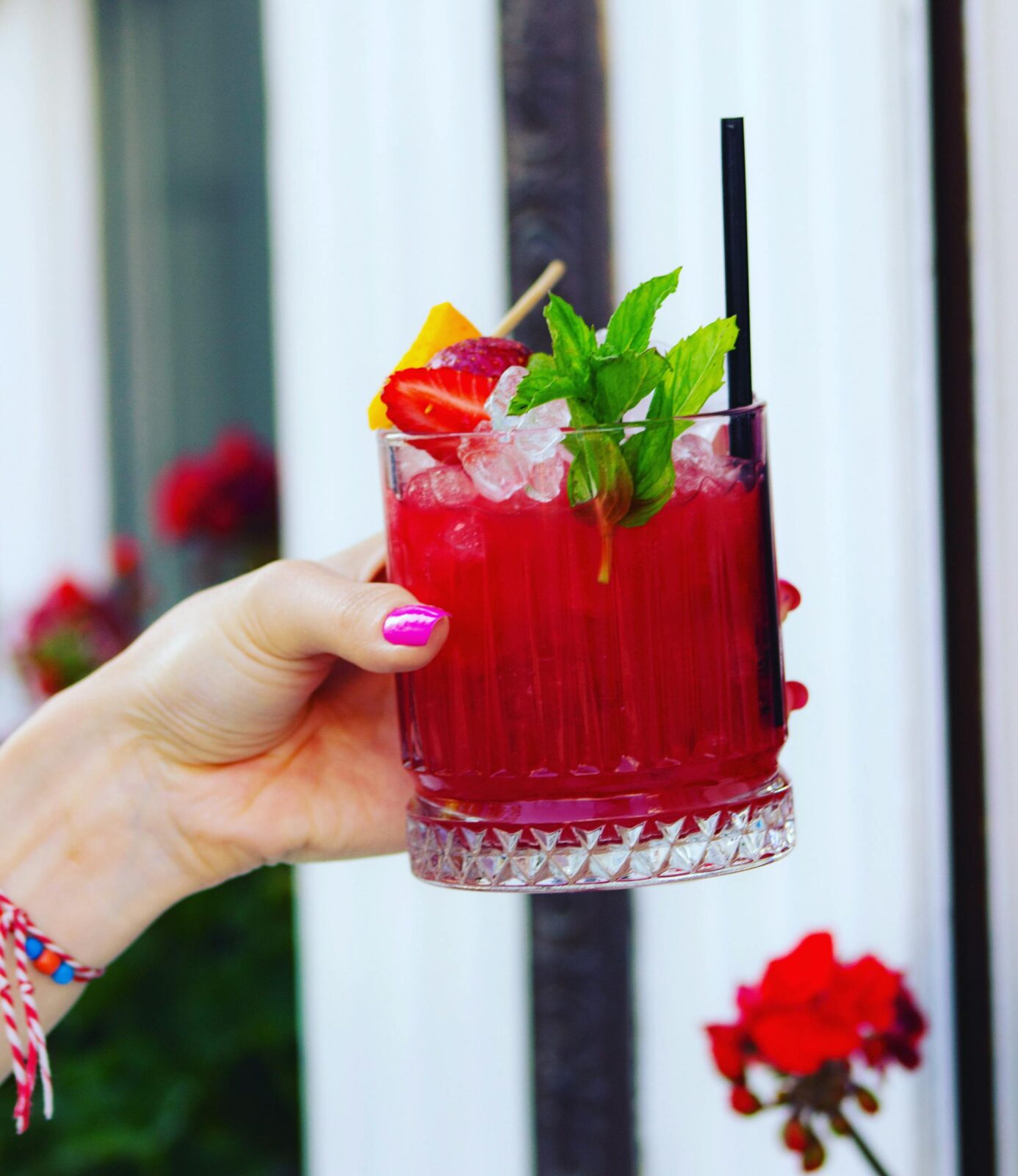 Vibrant berry mocktail garnished with mint, perfect for a refreshing summer day.