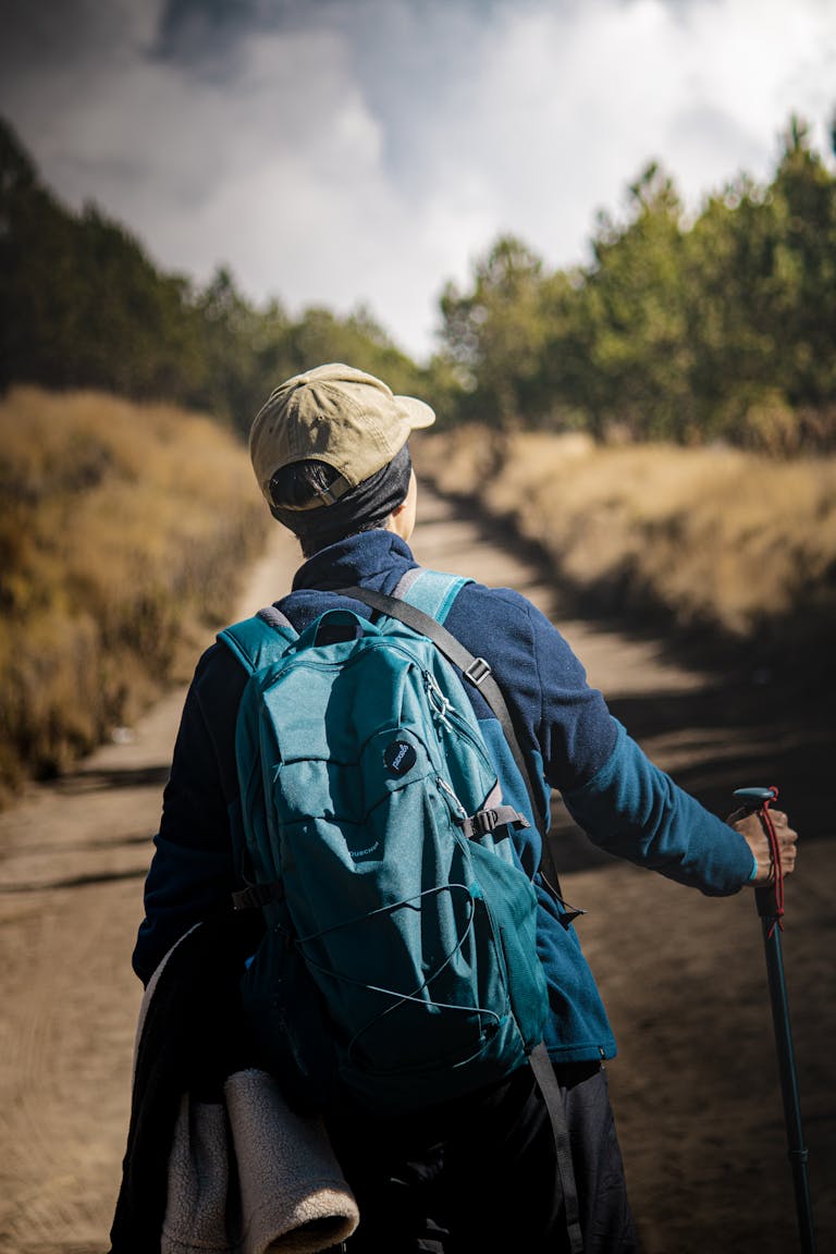 Adventurous hiker on a scenic trail in Puebla, México, embracing nature with hiking gear.