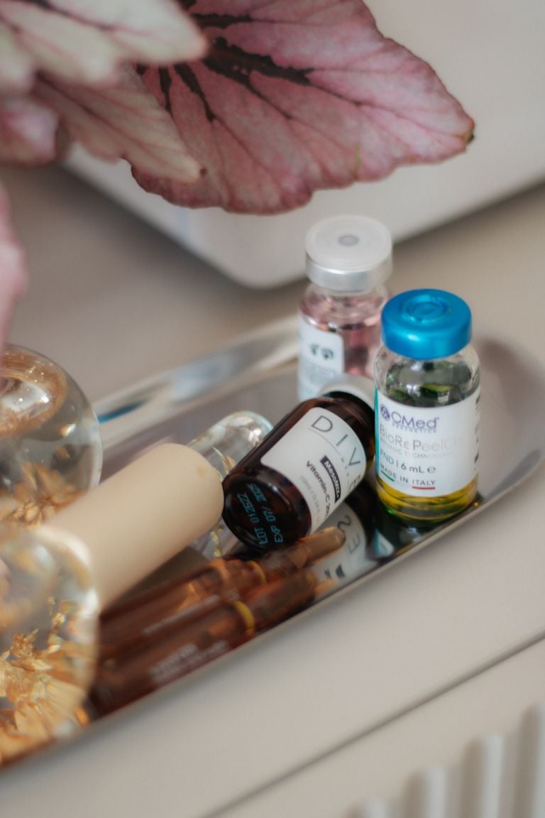Aesthetic display of skincare products on a tray, perfect for beauty and wellness themes.