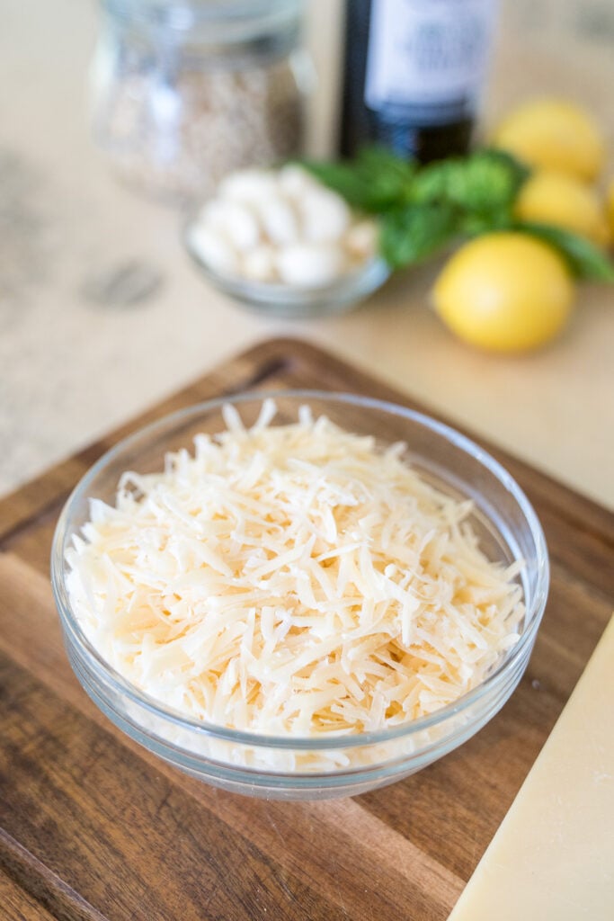 Freshly grated Parmesan in a glass bowl