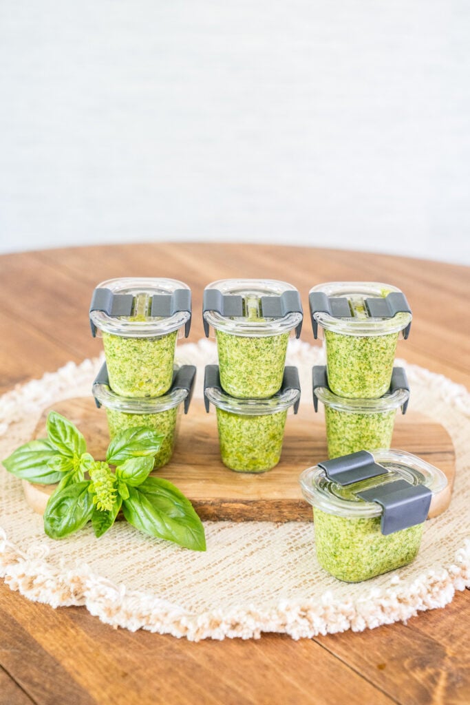 Sealed half-cup containers of homemade basil pesto