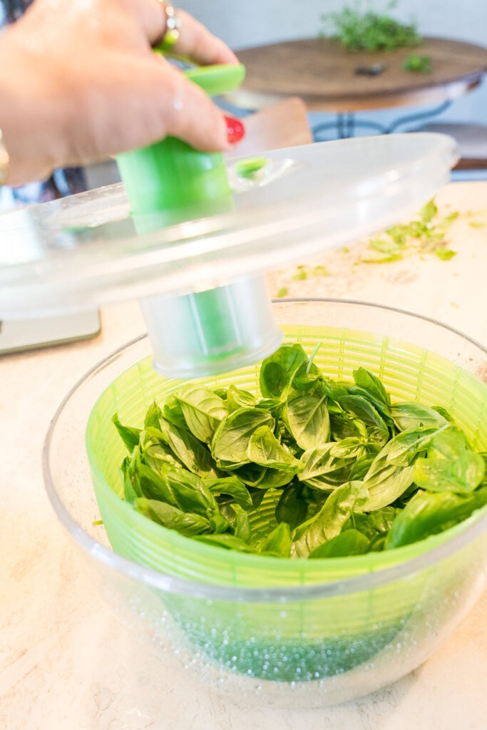 Spinning basil leaves to remove rinse water