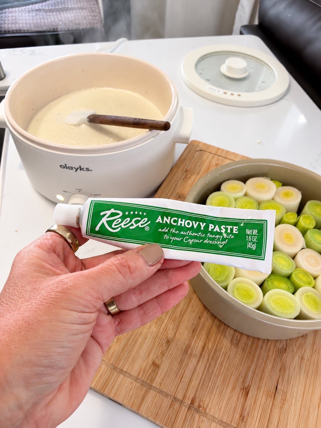 Anchovy paste beside the leeks and saucepan in the camper kitchen