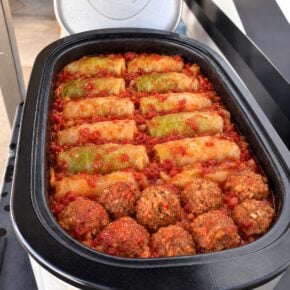 Enhanced presentation of stuffed cabbage rolls and porcupine meatballs in tomato sauce in an electric roaster
