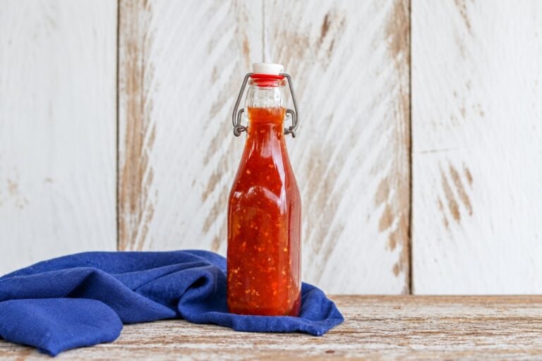 AI-enhanced view of the original sweet chili sauce bottle on blue linen
